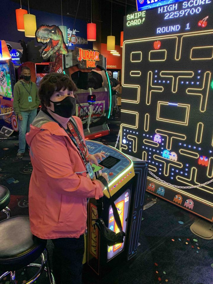 Member enjoying a game at Dave & Busters